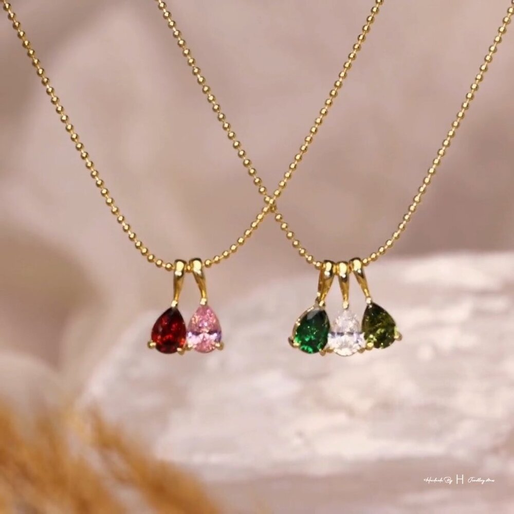 Twelve Birthstone Teardrop Necklace featuring teardrop-shaped gemstones